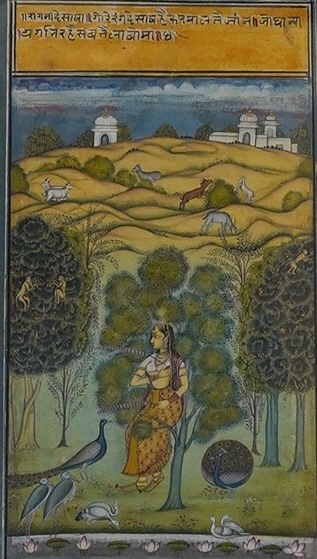 A single leaf from a Rajastani Ragamala from Bikaner, 18th century, female figure walking in garden, Hindi text at head, 23.5cm x 13.5cm. Condition - fair to good